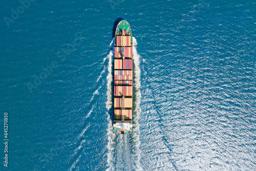 Loaded container ship cruising open ocean sea for logistics import export, aerial shot © Leonid