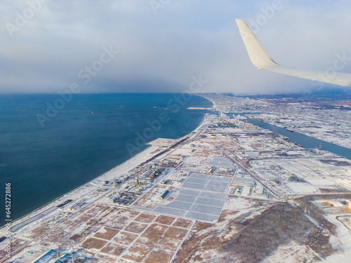 Snow-covered port town seen from the sky (Tomakomai, Hokkaido, Japan) photo