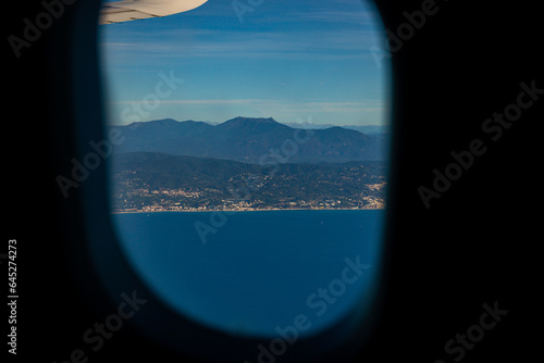 Barcelona city, Spain looked from an airplane view from the sky. Beautiful sunny clear blue sky day. Travel fly concept. High quality photo
