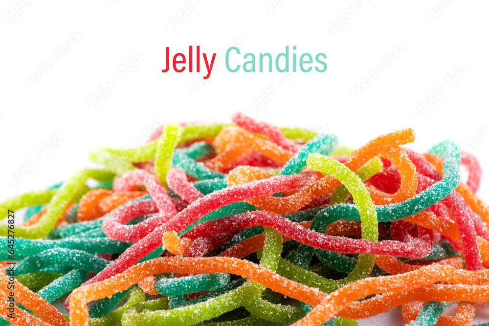 Multicolored jelly candies in the shape of the sticks sprinkled with sugar on a white background