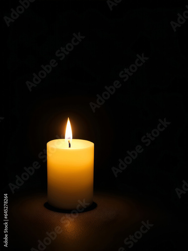 a candle in the dark background