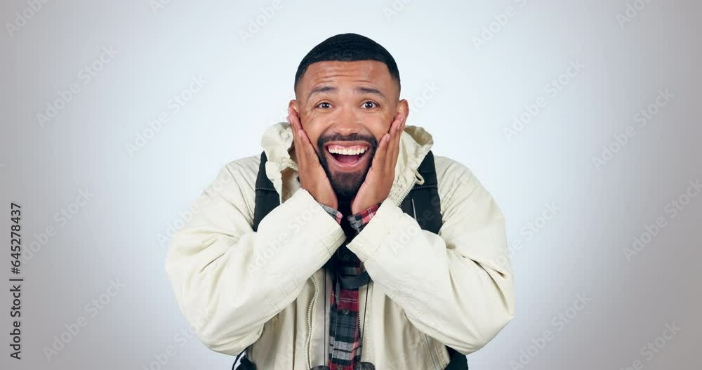 Excited, man and face with travel, wow and happy from surprise and adventure in studio. Smile, shock and African male person ready for holiday and vacation with grey background and omg emoji gesture Excited, man and face with travel, wow and happy from surprise and adventure in studio. Smile, shock and African male person ready for holiday and vacation with grey background and omg emoji gesture