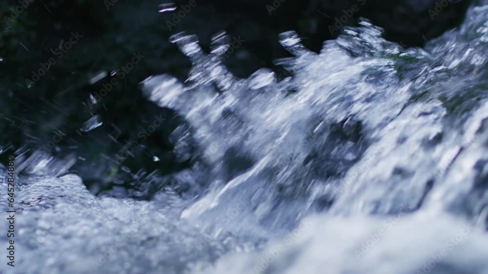 Water flowing in rapids, close up slow motion Water flowing in rapids, close up slow motion