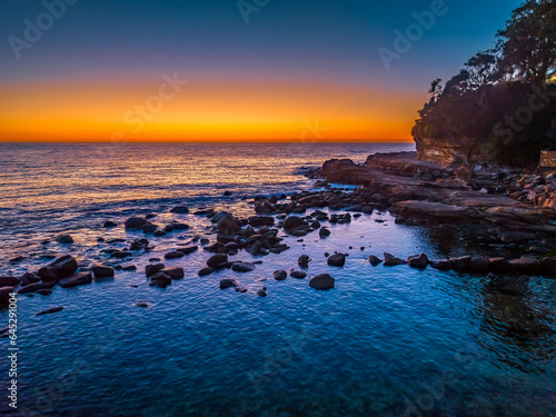 Sunrise over the ocean with orange horizon