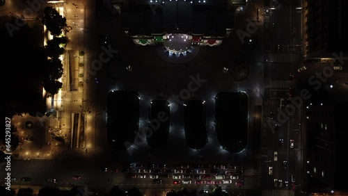 Dusk falls over the Palacio de Bellas Artes in Mexico City. with the mexico flag colors drone view photo