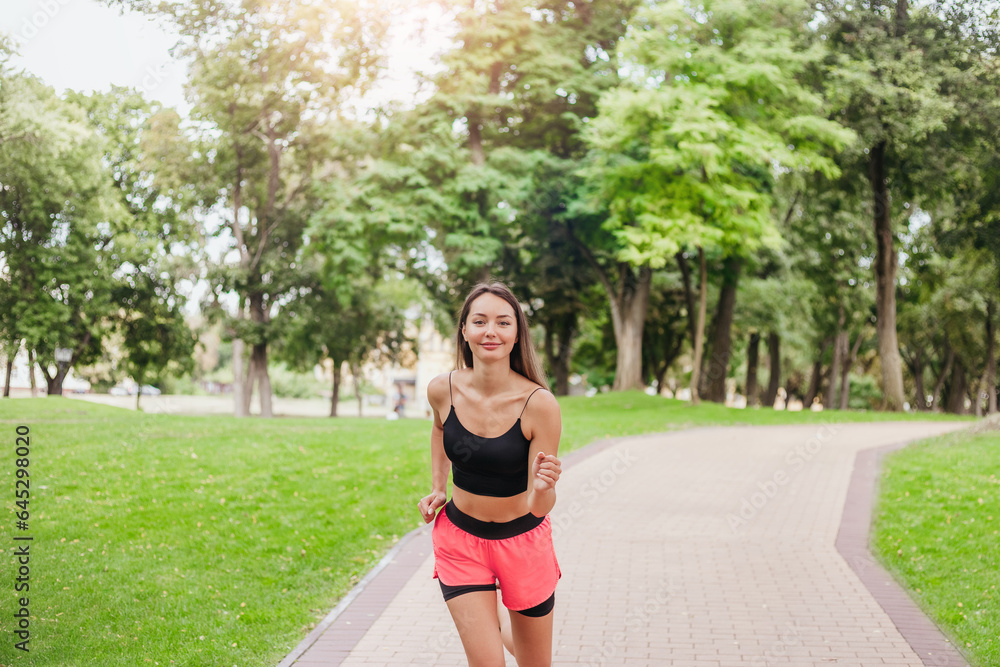 happy caucasian girl jogging in the park