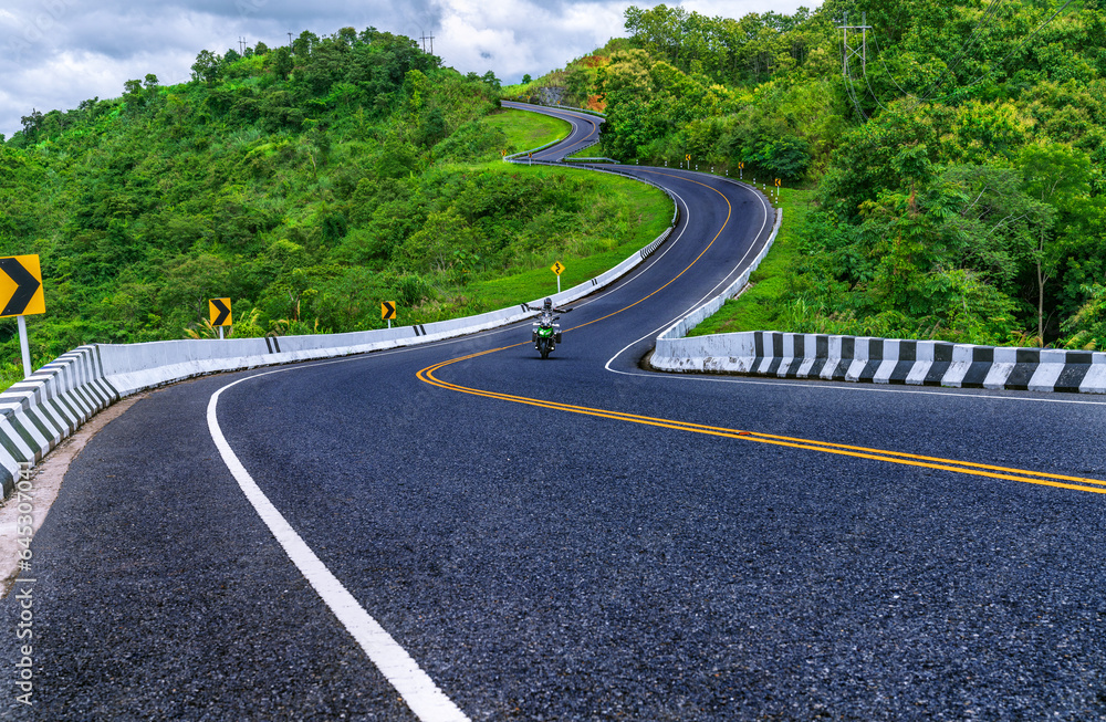 Road no.3 or sky road over top of mountains with green jungle in Nan province, Thailand.