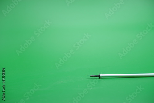 pen refill isolated green background