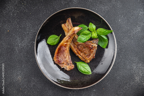 lamb cutlet on the bone fresh meat portion food ready to eat healthy appetizer meal food snack on the table