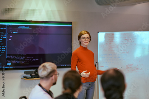 A pregnant business woman with orange hair confidently presents her business plan to colleagues in a modern glass office, embodying entrepreneurship and innovation