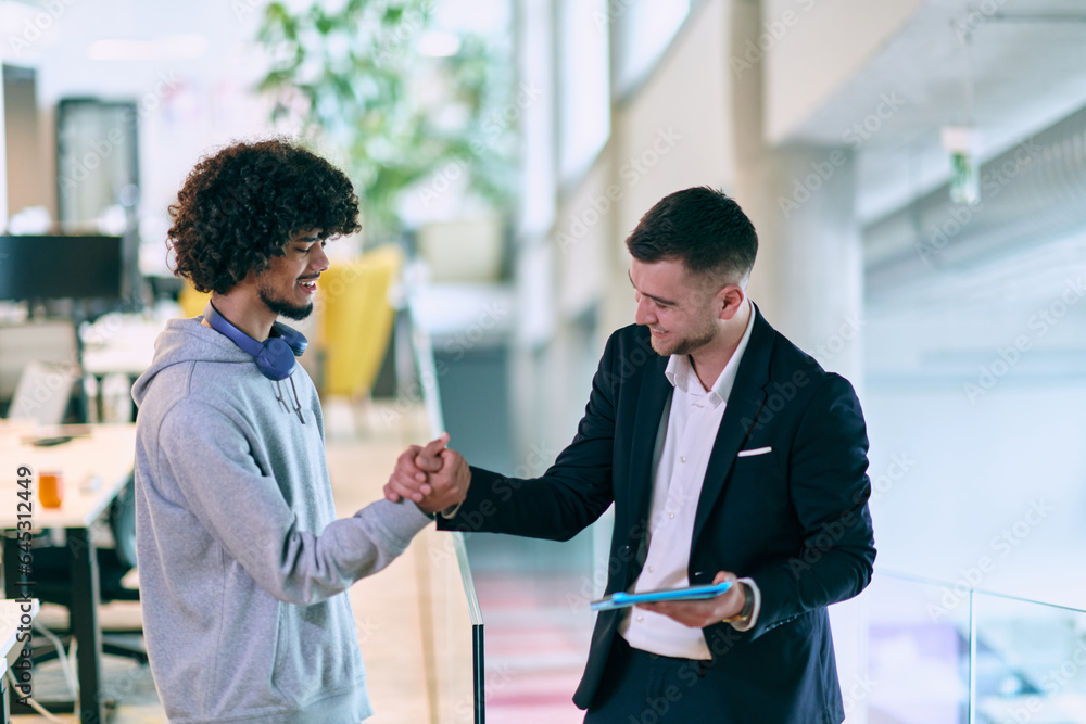 In a modern office setting, an African American businessman and his director confidently extend their hands in congratulations, symbolizing successful resolution of a business problem, amidst a In a modern office setting, an African American businessman and his director confidently extend their hands in congratulations, symbolizing successful resolution of a business problem, amidst a