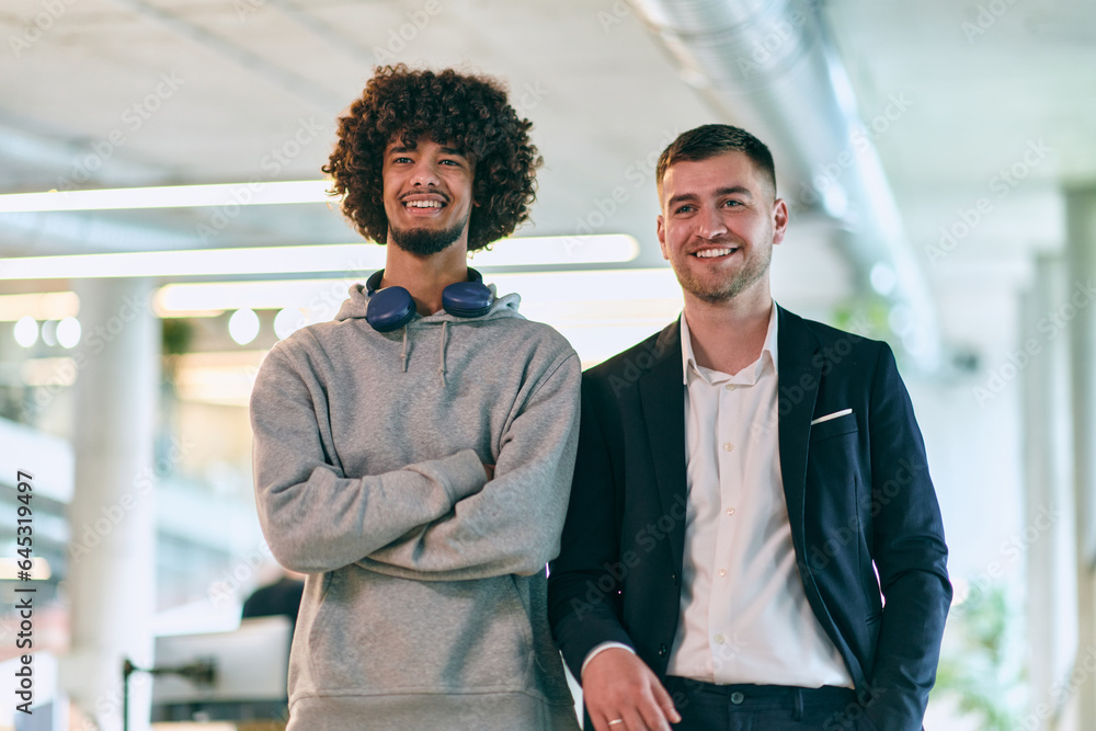 In a modern startup office setting, a business director and a young African American entrepreneur sit surrounded by their colleagues, embodying diversity and teamwork in the corporate world. In a modern startup office setting, a business director and a young African American entrepreneur sit surrounded by their colleagues, embodying diversity and teamwork in the corporate world.