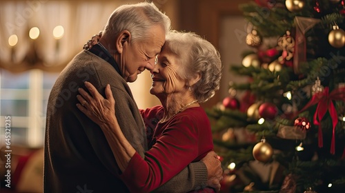 Elderly couple sharing a warm embrace under mistletoe, capturing timeless love during holidays.