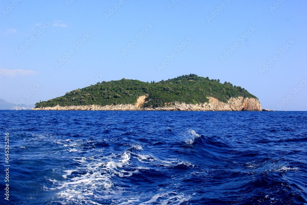Lokrum island in the Adriatic Sea near Dubrovnik, Croatia. Beautiful blue water of the Adriatic Sea in the foreground