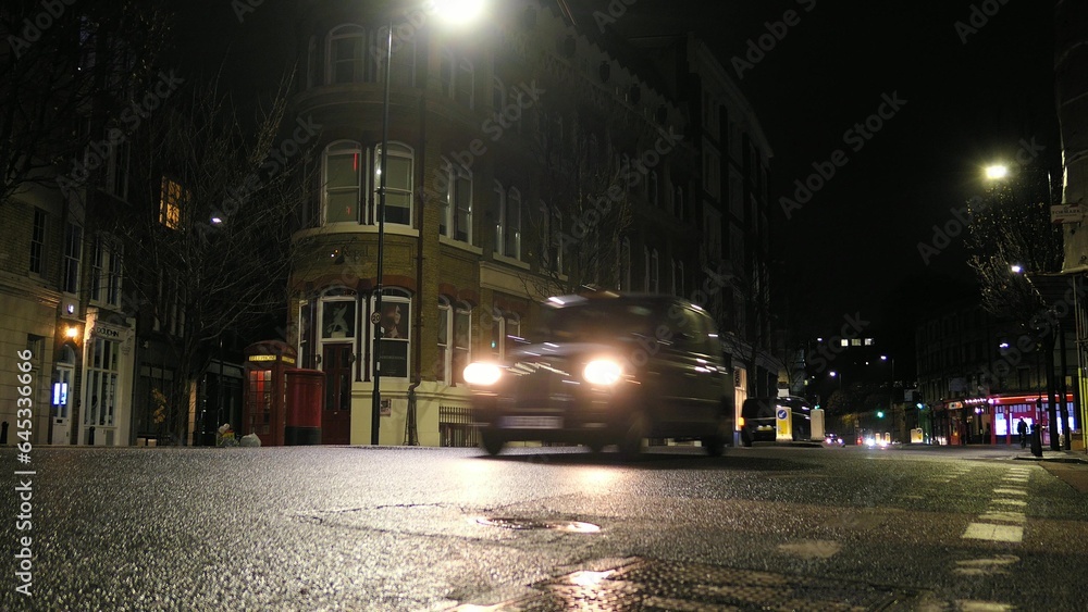 Cars Driving London Streets at Night