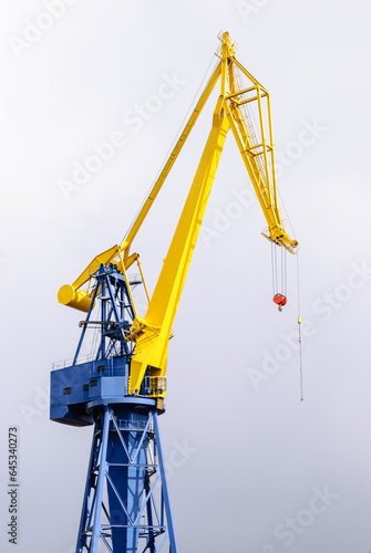 Wallpaper Mural Blue and yellow crane at a harbour for off-loading and loading ships. Torontodigital.ca