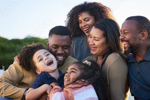 Children, parents and grandparents laughing outdoor at park to relax for summer vacation. African men, women and kids or funny family together for holiday with love, care and fun bonding in nature