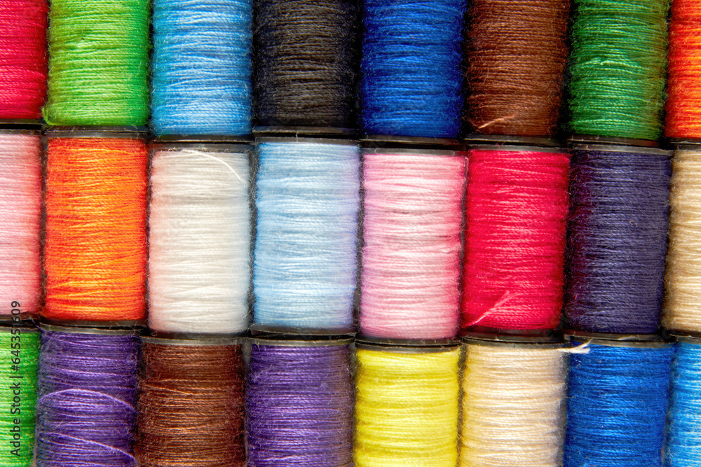 Texture pattern of the colorful thread spools. Embroidery and sewing background theme Texture pattern of the colorful thread spools. Embroidery and sewing background theme