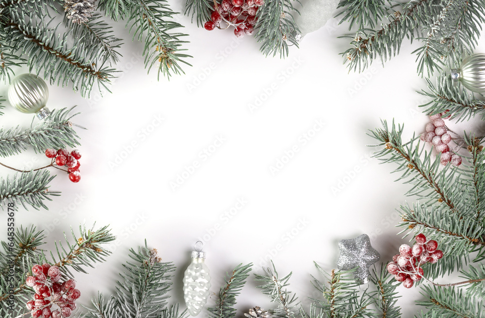 Christmas card with fir branches, viburnum berries covered with hoarfrost, and Christmas decorations. Copy space Christmas card with fir branches, viburnum berries covered with hoarfrost, and Christmas decorations. Copy space