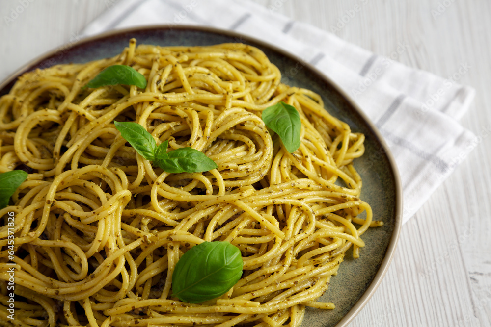 Homemade Vegan Pesto Pasta on a Plate, side view. Homemade Vegan Pesto Pasta on a Plate, side view.