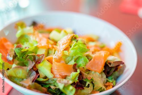 Smoked salmon salad with lettuce, walnuts and avocado, healthy food concept