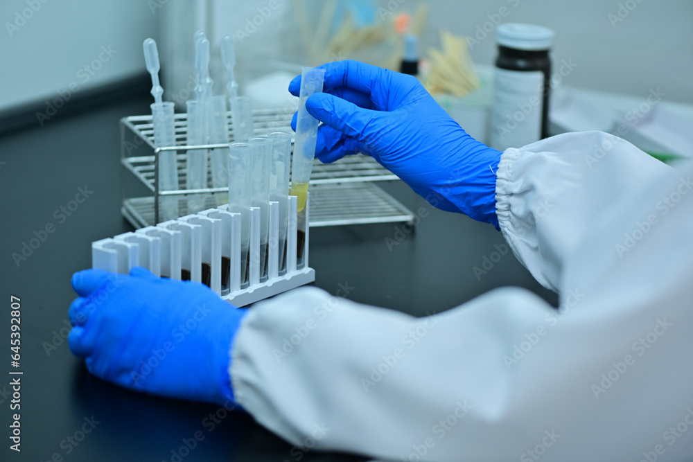 Female medical technologist using diagnostic equipment in cancer hospital lab in Asia Female medical technologist using diagnostic equipment in cancer hospital lab in Asia