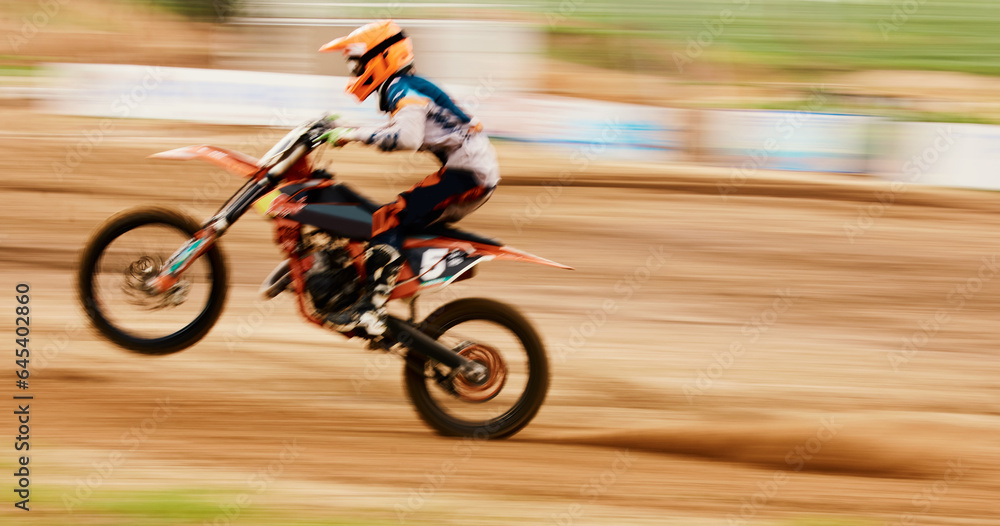 Motorcycle, balance and motion blur with a man training for a race or dirt biking challenge on space. Bike, fitness and power with a person driving fast on an off road course for freedom or speed