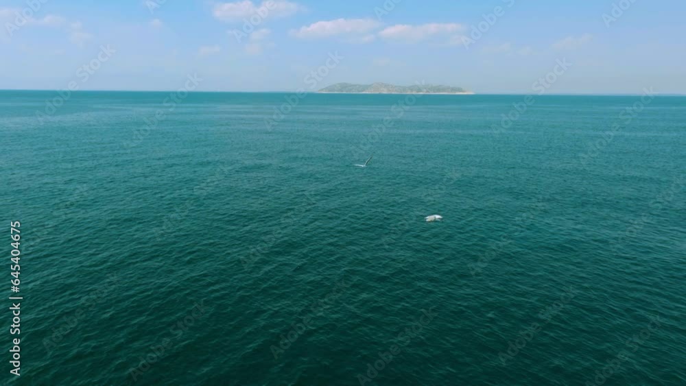 View from above, stunning aerial video shoot over a sea water. Aerial view of a blue sea water background. Waves water surface. View from above, stunning aerial video shoot over a sea water. Aerial view of a blue sea water background. Waves water surface.