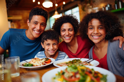 A joyful family shares a healthy meal, filled with smiles and laughter, whether dining at home or enjoying a restaurant outing