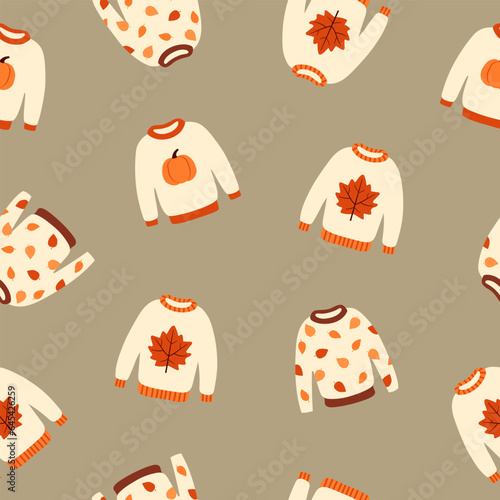 WebSeamless pattern with cute autumn sweaters. Pullovers with leaves and pumpkins on grey background. Cartoon flat style. Vector illustration