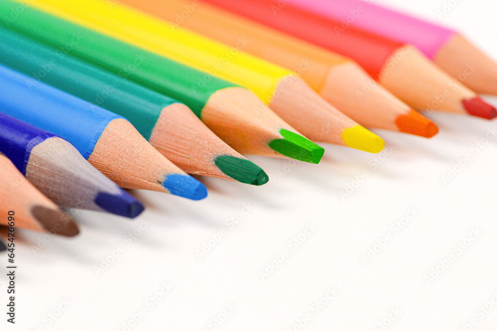 Colored pencils individually on a white background. Close-up. Colored pencils individually on a white background. Close-up.