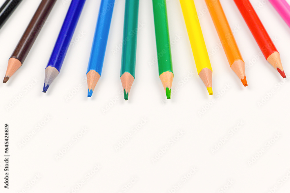 Colored pencils individually on a white background. Close-up. Colored pencils individually on a white background. Close-up.