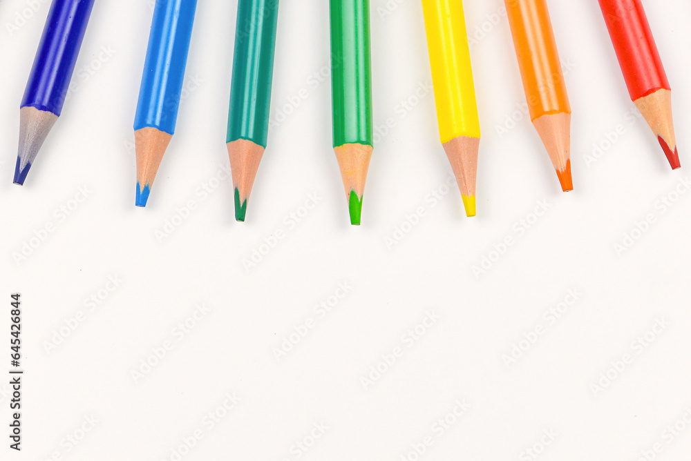 Colored pencils individually on a white background. Close-up. Colored pencils individually on a white background. Close-up.