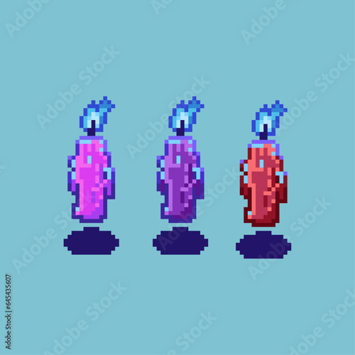 Pixel art sets of candle with blue fire halloween with variation color items asset. halloween candle on pixelated style.8bits perfect for game asset or design asset element for your game design asset.