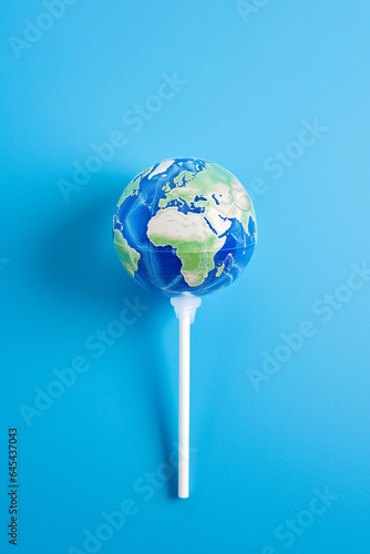 Earth lollipop, candy world. Climate change and ecology, world heritage, summer and travel concept, minimal idea for the global warming. Save the planet poster