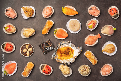 Portuguese marzipan delicacy in the shape of fruit objects and animals. Gourmet sweets from the Algarve Portugal on a marble background close-up.