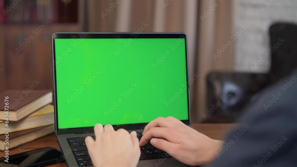 Girl Typing on Keyboard Laptop with Green Screen Mock-up. Close Up Chroma Key Computer Display Girl Typing on Keyboard Laptop with Green Screen Mock-up. Close Up Chroma Key Computer Display