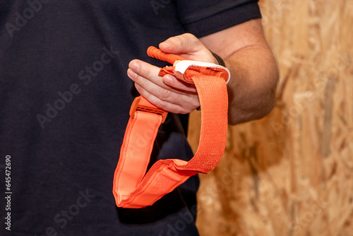 A medical worker holds tourniquet to provide first aid in case of injury or accident
