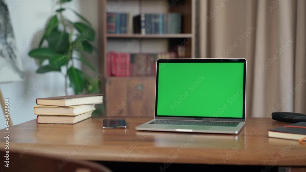 Laptop with Mock Up Green Screen Chroma Key Display Standing on Desk In Loft-style Office Laptop with Mock Up Green Screen Chroma Key Display Standing on Desk In Loft-style Office