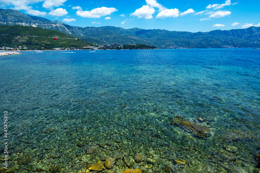 sea, sun and rocky shore, seascape of summer holidays, a beautiful seaside resort, a beach, a city in the distance and hotels on the mountainside, Adriatic Sea sea, sun and rocky shore, seascape of summer holidays, a beautiful seaside resort, a beach, a city in the distance and hotels on the mountainside, Adriatic Sea