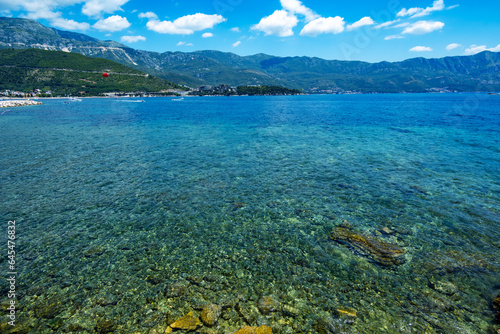 sea, sun and rocky shore, seascape of summer holidays, a beautiful seaside resort, a beach, a city in the distance and hotels on the mountainside, Adriatic Sea