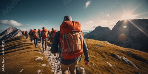 Hiking Groups with Backpacks Explore Majestic Mountains under a Clear Blue Sky, Highlighting Environmental Protection, but Also the Challenges of Overcrowding and Environmental Pollution