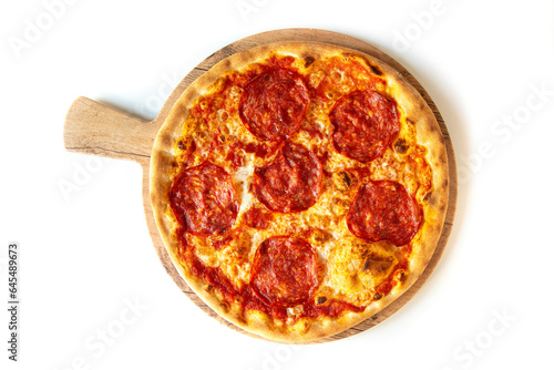 traditional italian pizza with tomato, mozzarella, spicy salami, from above and close up isolated on white wooden table 