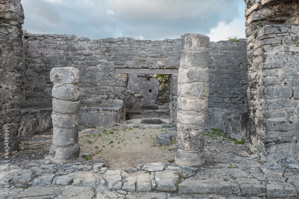 Tulum, Mexico, Dez 2017. The Temple of the God of the Wind, a small building that sits on a high point along the cliff at the Mayan ruins, with Caribbean Sea lies far below on one side.