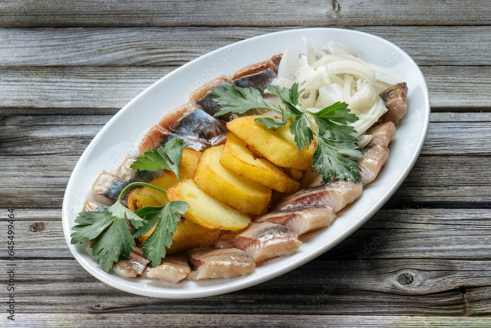 Herring with potatoes, cilantro, onions. Classic Russian dish. Herring with potatoes, cilantro, onions. Classic Russian dish.