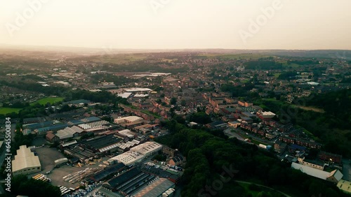 Wallpaper Mural Heckmondwike, UK, captured by a drone, featuring industrial buildings, vibrant streets, the old town center, and the scenic Yorkshire view on a summer evening. Torontodigital.ca