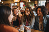 A multi-ethnic group of women laughing together as they share stories during a cozy coffee shop meetup. Capture the genuine joy and camaraderie in their expressions. Generative AI