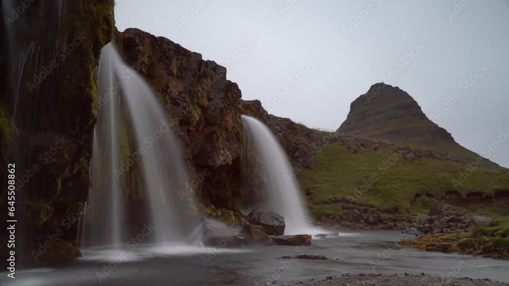 Kirkjufellsfoss waterfall with the mountains in iceland Kirkjufellsfoss waterfall with the mountains in iceland