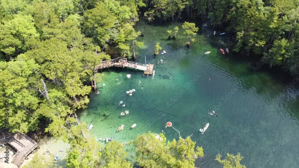 Jumping off deck, swimming, floating, leisure on magnitude turquoise ...