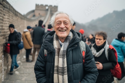 Group portrait photography of a satisfied man in his 80s that is smiling with friends at the Great Wall of China in Beijing China